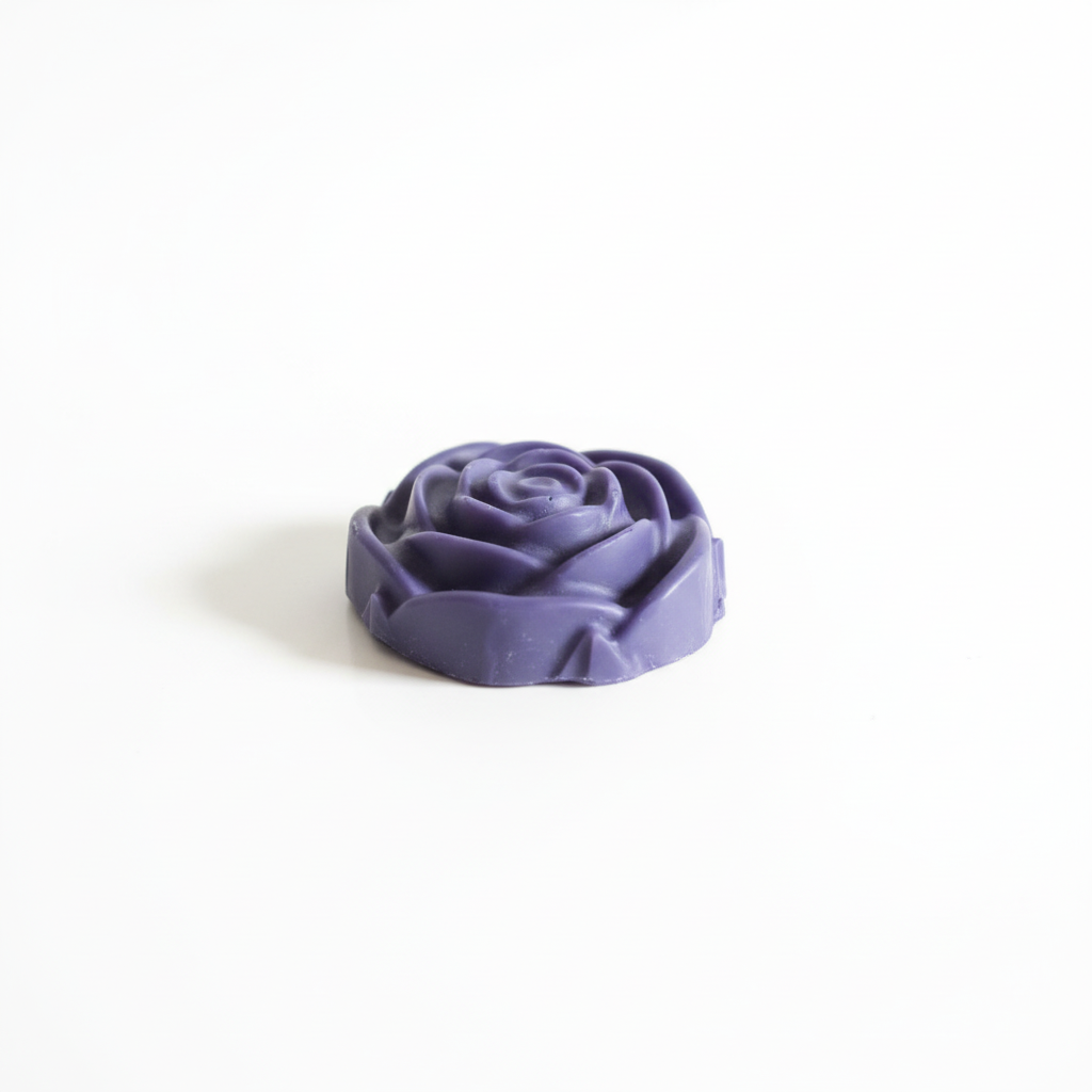 Lavender flower-shaped wax melt on white background