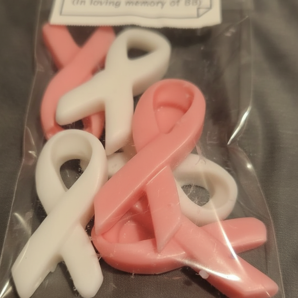 Close-up of pink and white ribbon wax melts