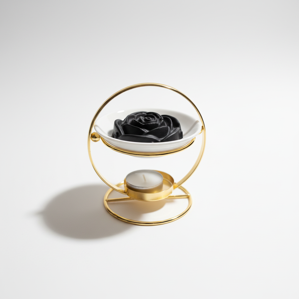 Black flower-shaped wax melt on white background